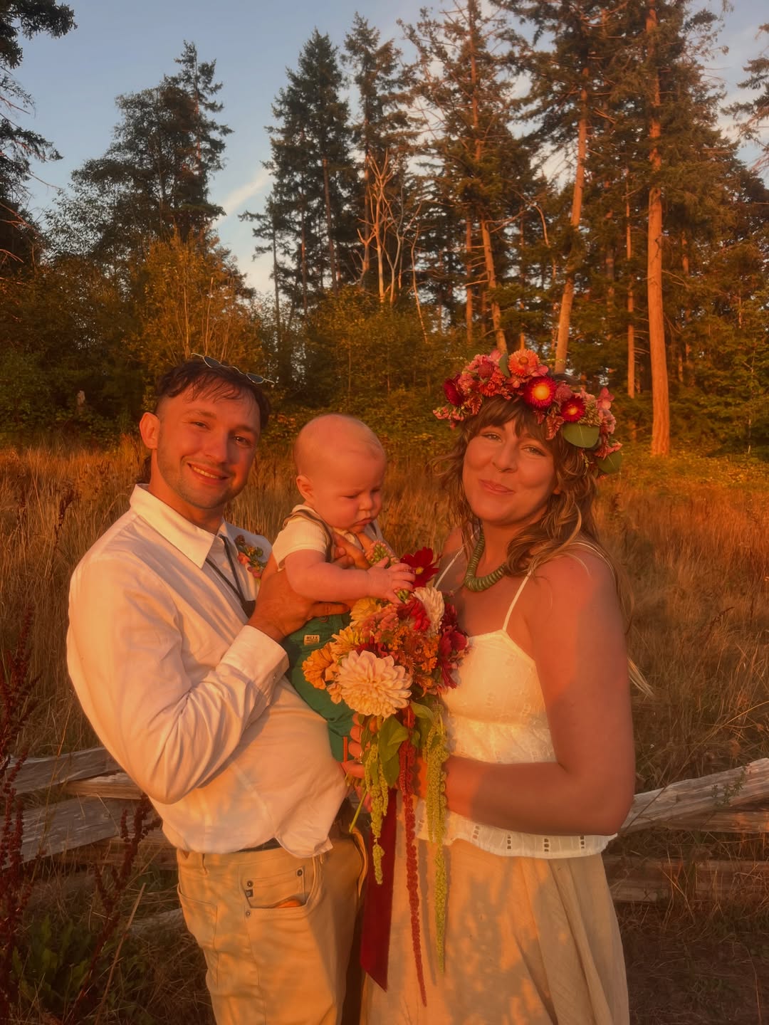 Samuel with his wife and baby on their wedding day, in golden evening light